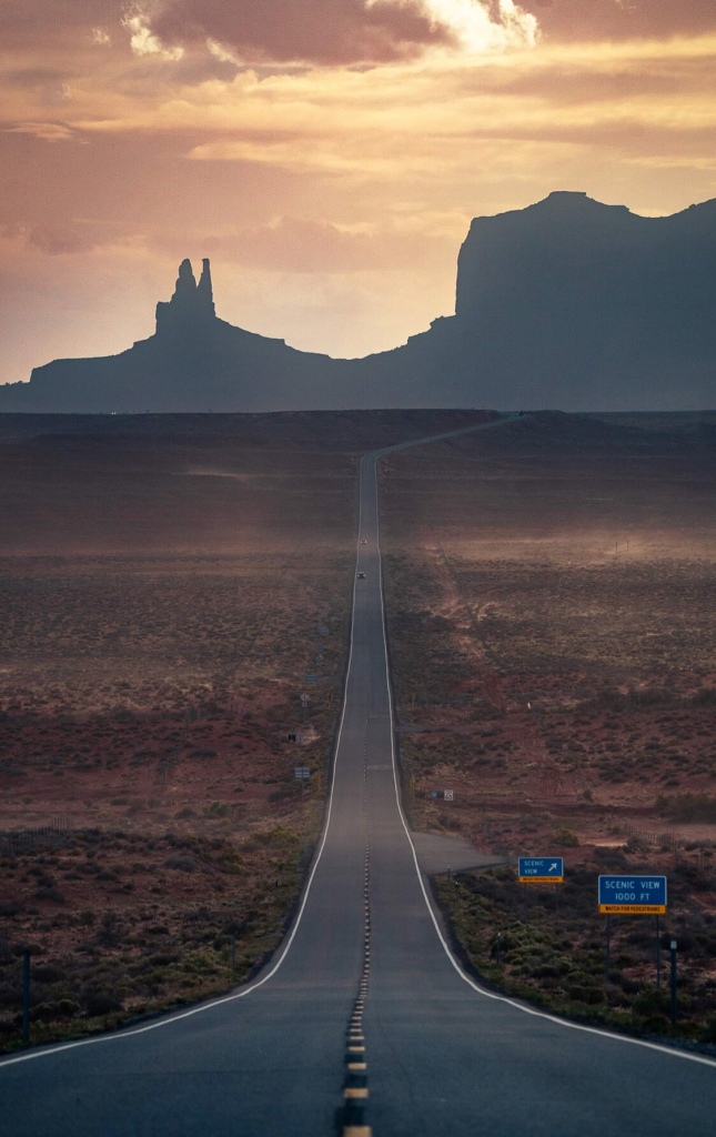 Monument Valley road through Tribal Lands at sunset