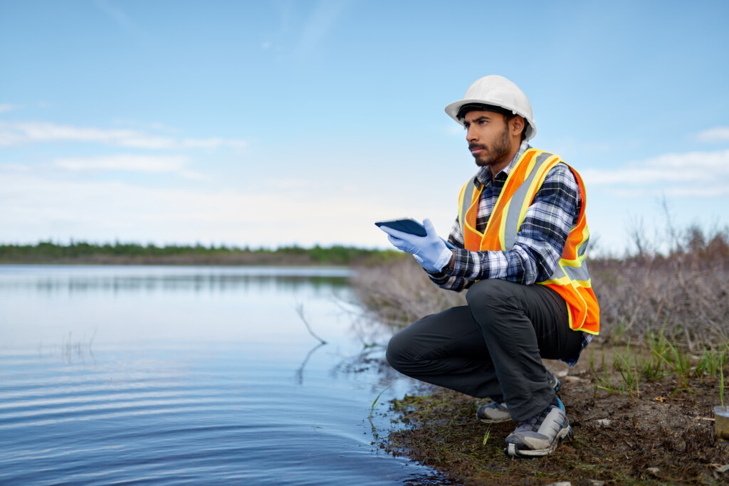 Marine biologist analysing water test results on a tablet in Canada